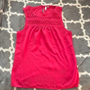 Fuscia sleeveless tank with detailed top.